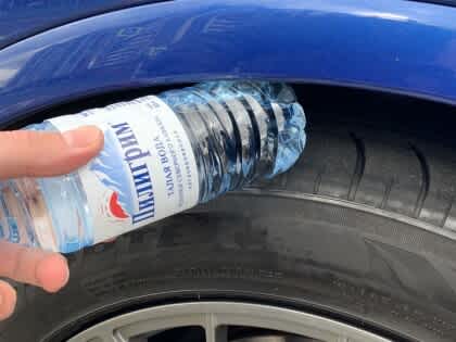 Put a Bottle on Your Car Tire when Parking Alone
